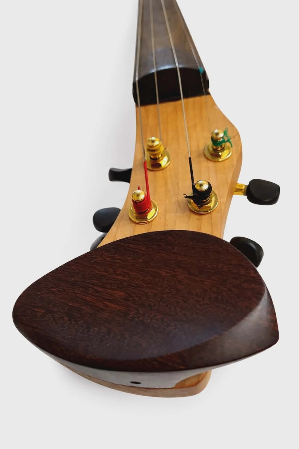Rear view of the Koton violin showing the output jack and shoulder rest system