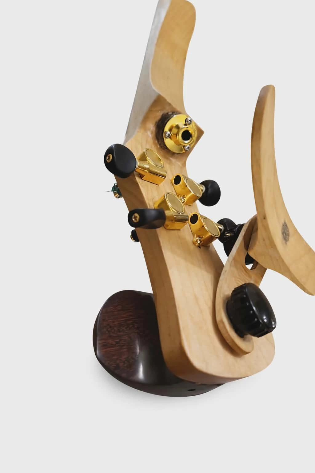 Rear view of the Koton violin showing the output jack and shoulder rest system